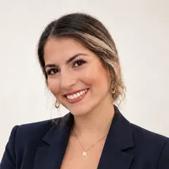 Jana Infante, co-founder of Ethos Web Development & SEO, smiling in a navy blazer